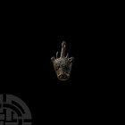 Medieval Bull's Head Heraldic Horse Harness Pendant 13th-14th century A.D. A zoomorphic horse harness pendant composed of a stylised bull's head plaqu...