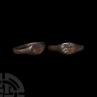 Norman Ring with Horse and Rider 11th-12th century A.D. A finger ring with slender D-section hoop, expanding at the shoulders to an oval bezel engrave...