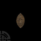 Medieval Vesica-Shaped Lead Seal Matrix 13th-14th century A.D. A vesica-shaped seal matrix with stylised fleur-de-lys at centre, legend around; lug to...