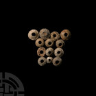 Medieval Lead Spindle Whorl Collection 12th-16th century A.D. A mixed group of lead spindle whorls, many decorated with pellets or geometric motifs. 5...