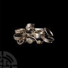 Mixed Ring Group 20th century A.D. A mixed group of silver-coloured metal finger rings, including examples with bezels formed as dragons, hearts, wild...