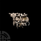 Mixed Charm and Brooch Group 20th-21st century A.D. A mixed group of 12 charms and brooches in the form of animals, a heart, bears, a cherub, pram and...