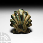 Post Medieval Glazed Palmette Shell 18th-19th century A.D. or earlier. A glazed, mottled-green appliqué in the form of a shell with a ribbed body and ...