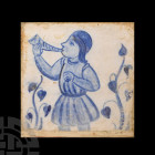 Spanish Blue and White Tile with Man Blowing a Horn 18th-19th century A.D. A blue and white tin-glazed ceramic tile showing a man dressed in 16th cent...