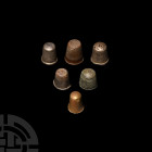 Post Medieval Thimble Collection 18th-19th century A.D. A mixed group of silver and copper-alloy thimbles, including hallmarked examples and two engra...