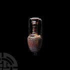 Phoenician Style Sandcore Glass Amphora 20th century A.D. A core-formed polychrome glass amphora with feathering to the body and spirals decorating th...