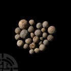 Post Medieval Musket Ball Group 17th-18th century A.D. A mixed group of musket balls of various sizes. 286 grams total, 8-19 mm (3/8 - 3/4 in.). Found...