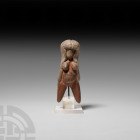 Prehispanic Valdivia Style Venus Figure 20th century A.D. A figurative ceramic sculpture representing a naked female figure, modelled in the round wit...