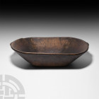 Prehispanic Inca Wooden Food Dish Early 16th century A.D. A large wooden food dish, roughly oval in shape with splayed walls. 2.3 kg, 55.2 cm length (...