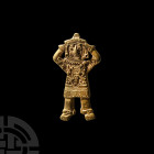 South American Gold Figural Amulet 20th century A.D. A figural amulet in the form of a standing male figure with hands clasping his head, detailing to...