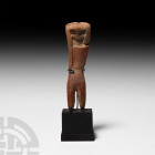 Prehispanic Valdivia Style Figure 20th century A.D. A figurative ceramic sculpture representing a naked female figure, modelled in the round without a...