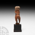 Prehispanic Valdivia Style Figure 20th century A.D. A figurative ceramic sculpture representing a naked hermaphrodite figure, modelled in the round wi...