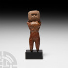 Prehispanic Valdivia Style Figure 20th century A.D. A figurative ceramic sculpture representing a naked female figure, modelled in the round with arms...