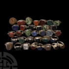 Bedouin Ring Collection 20th century A.D. A mixed group of silver-coloured metal finger rings of various types with engraved and raised motifs to the ...