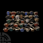 Bedouin Ring Collection 20th century A.D. A mixed group of silver-coloured metal finger rings of various types with engraved and raised motifs to the ...