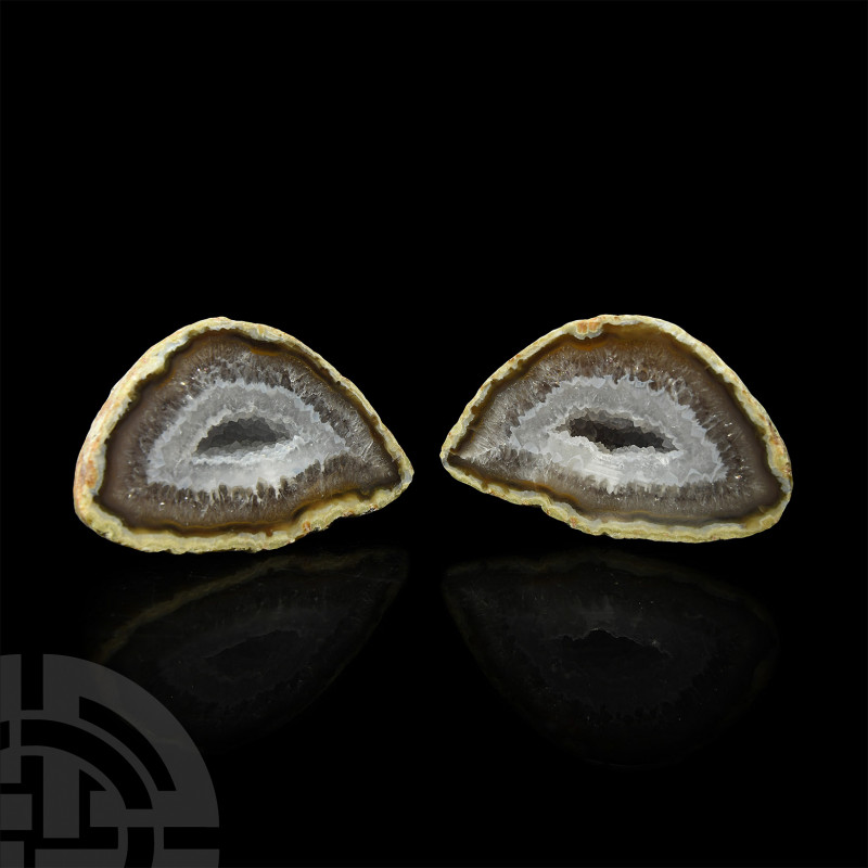 Cut and Polished Agate Geode Pair A cut and polished agate geode pair, with a fr...