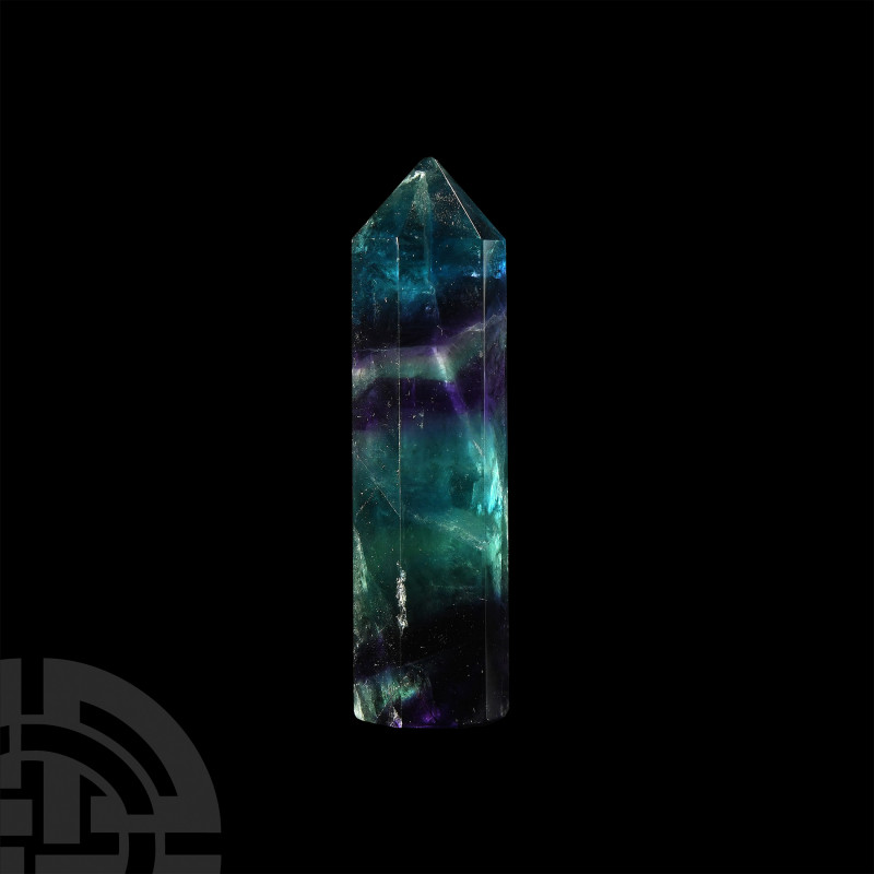 Large Fluorite Obelisk A large fluorite obelisk with dark purple and green bandi...