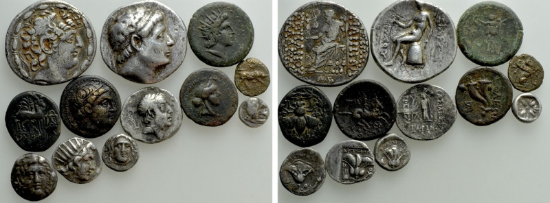 12 Greek Coins; Including two Tetradrachms. 

Obv: .
Rev: .

. 

Conditio...