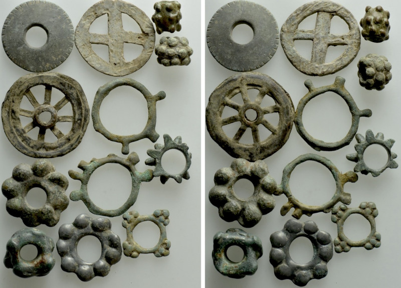 12 Pieces of Celtic Ring Money / Rouelles. 

Obv: .
Rev: .

. 

Condition...