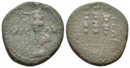 Macedon, Philippi, c. AD 41-68. Æ (18mm, 4.90g). Nike standing l. on base, holding wreath and palm. R/ Three standards. RPC I 1651; SNG Copenhagen 305...