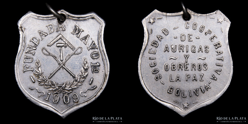 Bolivia. 1909. Sociedad Cooperativa de Aurigas y Obreros. Plata; 28x24mm; 7.1g. ...