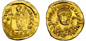 Byzantine Empire Justin I AU Solidus AD 518-519 Constantinople mint Victory standing left, holding long staff surmounted by reversed staurogram, in le...