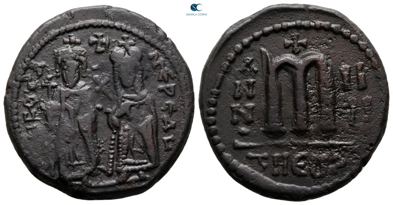 Phocas, with Leontia AD 602-610. Theoupolis (Antioch)
Follis or 40 Nummi Æ

2...