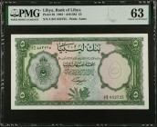 LIBYA. Bank of Libya. 5 Libyan Pounds, 1963. P-26. PMG Choice Uncirculated 63.
PMG Pop 1/3 Finer.
Estimate $300.00 - $500.00