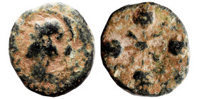 GREEK. Ae (bronze, 1.42 g, 13 mm). Helmeted bust, left. Rev. Four poppy (?) ears, centrally connected. Nearly very fine.