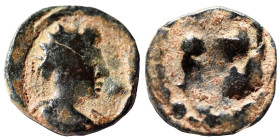 Uncertain. Ae (bronze, 0.59 g, 11 mm). Head right. Uncertain design. Nearly very fine.