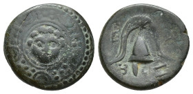Kings of Macedon. Alexander III ‘the Great’ (336-323 BC). Æ (16mm, 4g). Salamis. Macedonian shield with gorgoneion in boss. R/ Crested helmet; caduceu...