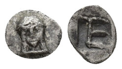 Ionia. Kolophon circa 450-410 BC. Tetartemorion AR 6 mm, 0,1 g Facing head of Apollo with long hair / TE monogram within incuse square.