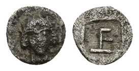 Ionia. Kolophon circa 450-410 BC. Tetartemorion AR 6 mm, 0,1 g Facing head of Apollo with long hair / TE monogram within incuse square.