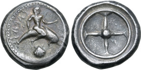 Calabria, Tarentum AR Nomos. Circa 480-470 BC. Taras astride dolphin to right; scallop shell below, TARAS (retrograde) behind / Wheel with four spokes...