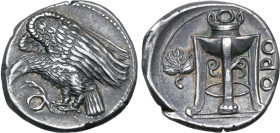 Bruttium, Kroton AR Stater. Circa 425-350 BC. Eagle standing to left, wings spread and head lowered, on serpent below / Tripod with high neck surmount...