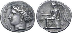 Bruttium, Terina AR Drachm. Circa 300 BC. Head of the nymph Terina to left, TEPINAIΩN before, triskeles behind / Nike seated to left on plinth, the ba...