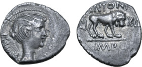 Marc Antony AR Quinarius. Lugdunum, early 42 BC. Winged bust of Victory to right, with the likeness of Fulvia; III•VIR•R•P•C around / Lion walking to ...