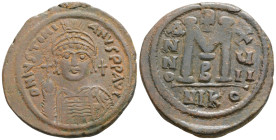 Byzantine 
Justinian I (527-565 AD) Nicomedia
AE Follis (36.1mmm, 20.8g)
Obv: D N IVSTINIANVS P P AVG. Helmeted and cuirassed bust facing, holding glo...