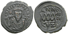 Byzantine
Phocas (602-610 AD) Kyzikos
AE Follis (31.2mm, 11.4g)
Obv: Crowned bust facing, wearing consular robes, holding mappa and cross; small cross...