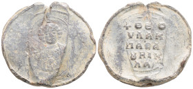 Byzantine lead seal. (10th-12th centuries).
Obv: Uncertain Saint
Rev : 5 (Five) lines text
(12.2 g 32.5 mm diameter)