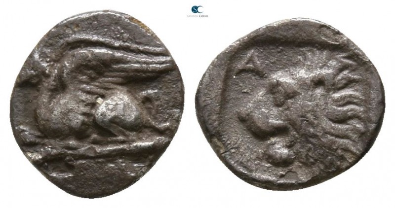 Troas. Assos circa 450-420 BC. 
Obol AR

8mm., 0,39g.

Griffin seated left ...