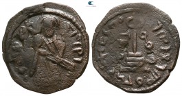 Umayyad Caliphate circa AD 690. Standing Caliph type. Uncertain mint. Fals Æ