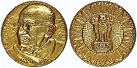 Mahatma Gandhiji, 1869-1948
Médaille en or, AU 29.57 g. 35 mm by Huguenin Conservation : NGC MS 66. FDC. Top pop