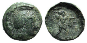 Northern Lucania, Poseidonia, c. 420-390 BC. Æ (15mm, 3.11g, 12h). Helmeted head of Athena r. R/ Poseidon wielding trident r. HNItaly 1155; Grunauer V...