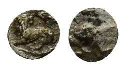Samaria, "Middle Levantine" Series, c. 375-333 BC. AR Hemiobol (6mm, 0.38g). Baal seated l., holding sceptre. R/ Lion standing l., head r.; anchor abo...