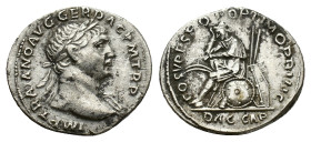 Trajan (98-117). AR Denarius (19mm, 3.34g). Rome, 108-9. Laureate bust r., slight drapery. R/ Dacian seated l. on pile of arms, in attitude of mournin...