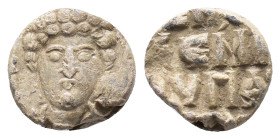 Byzantine Pb Seal, c. 7th-12th century (14mm, 4.44g). Facing bust of saint. R/ Legend in four(?) lines. Near VF
