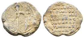 Byzantine Pb Seal, c. 7th-12th century (26mm, 9.68g). Nimbate saint standing facing, holding spear and shield. R/ Legend in seven lines. Near VF
