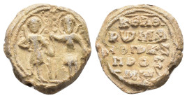 Byzantine Pb Seal, c. 7th-12th century (21mm, 12.38g). Two saints standing facing. R/ Legend in five lines. VF