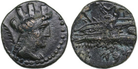 Phoenicia, Arados. Æ Circa 176-115 BC.
3.64g. 17mm. VF/XF Turreted head of Tyche right / Poseidon seated left on prow of galley. HGC 10, 89. 